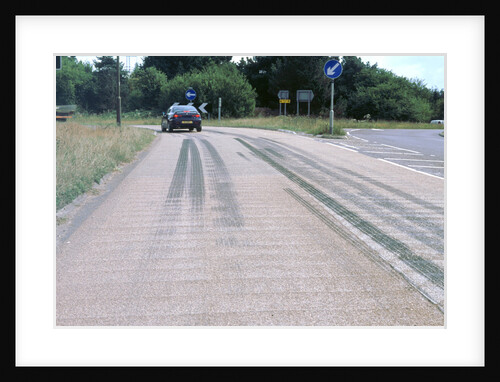 Tyre skidmarks on road surface by Unknown