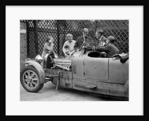 Denis Evans inspecting the plugs of his Bugatti Type 43 2262cc by Bill Brunell