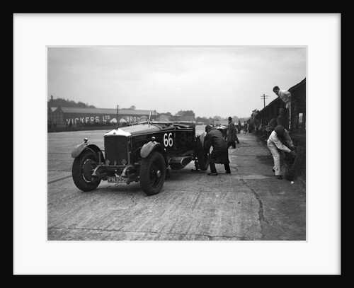 GL Baker's 5954 cc Minerva undergoing a rear wheel change at Brooklands by Bill Brunell