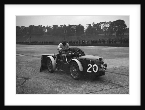 Mechanic making adjustments to a MG C type, Brooklands by Bill Brunell