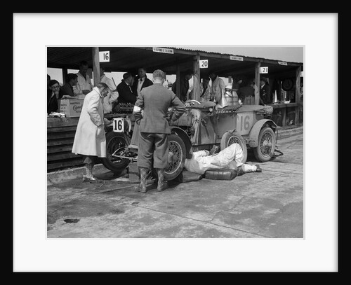 Mechanic working on a Lea Francis J type at the JCC Double Twelve race, Brooklands, May 1931 by Bill Brunell