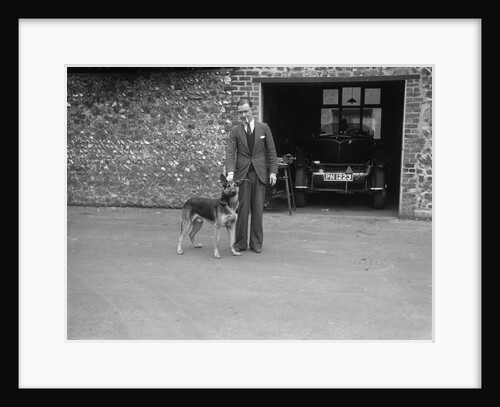 Geoffrey Baker standing in front of a Minerva 5954 cc car by Bill Brunell