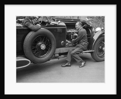 Geoffrey Baker inspecting the engine of a Minerva car by Bill Brunell