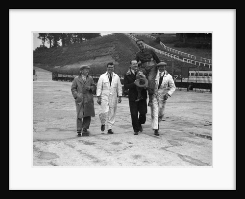 Leon Cushman being carried aloft after making a successful speed record attempt, Brooklands, 1931 by Bill Brunell