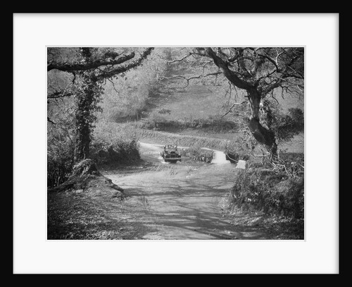 Kitty Brunell driving a 1930 Ford Model A 2-seater through a ford, 1931 by Bill Brunell