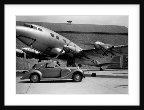 1938 Lagonda V12 4.5 litre drophead coupe with D.H. Albatross aeroplane by Unknown