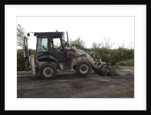 Road resurfacing work repairing potholes by Unknown