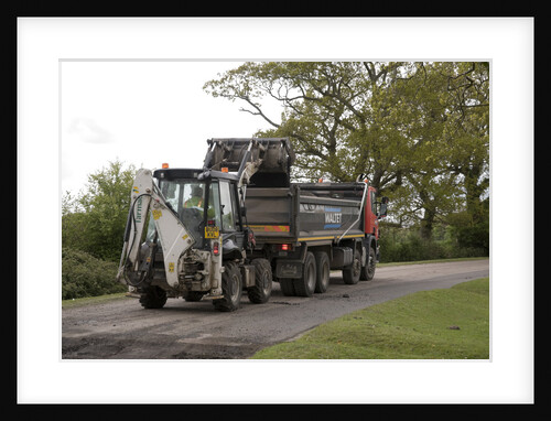 Road resurfacing work repairing potholes by Unknown