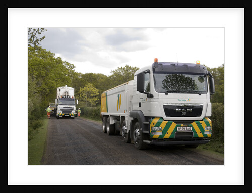 Road resurfacing work repairing potholes by Unknown