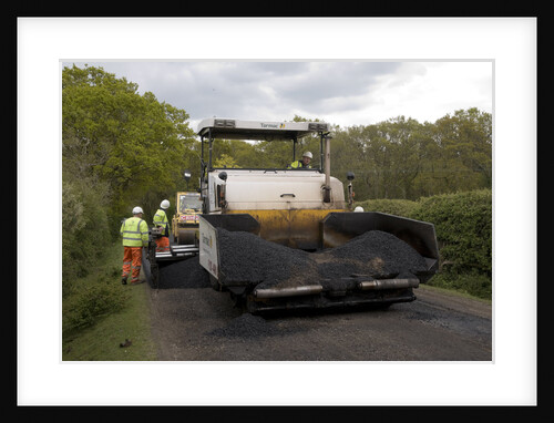 Road resurfacing work repairing potholes by Unknown