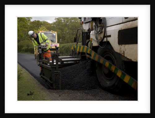 Road resurfacing work repairing potholes by Unknown