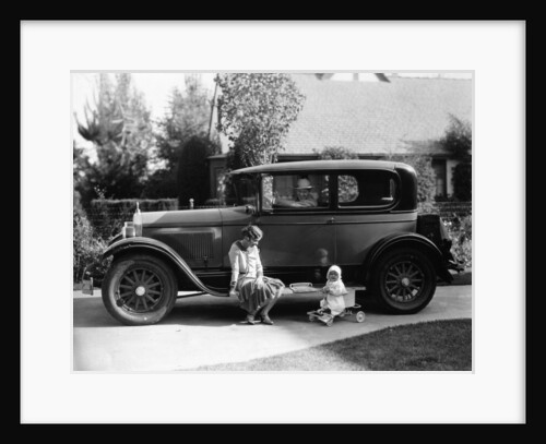 Stan Laurel at the wheel of 1927 Hupmobile with his wife Lois and daughter Lois by Unknown