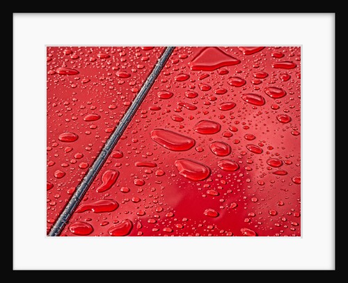 Raindrops beading on classic car paintwork by Anonymous