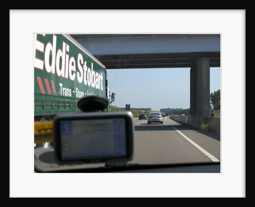 Passing Eddie Stobart truck on the A46 with satnav screen on windscreen by Anonymous