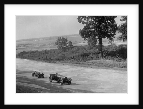 Bentley of FE Elgood and MG Magna of MB Watson racing at a MCC meeting, Brooklands, Surrey, 1933 by Bill Brunell