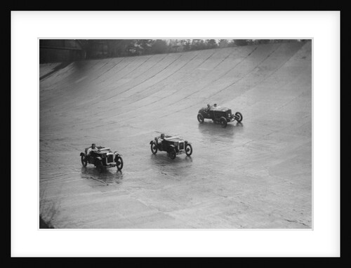 Two Austin 7s and an unidentified car racing at a BARC meeting, Brooklands, Surrey, 1931 by Bill Brunell