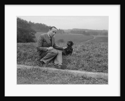 British racing driver Charles Mortimer and his pet dachshund, c1930s by Bill Brunell