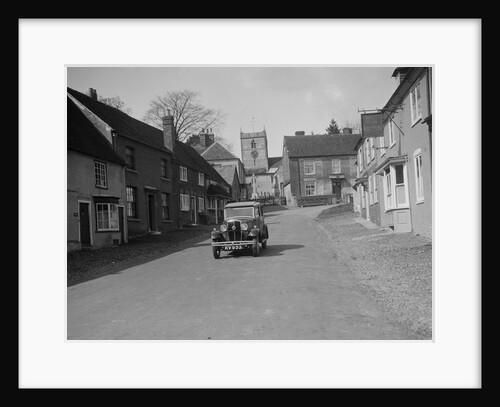 Standard Sixteen saloon driving down the High Street, Hambledon, Hampshire, 1930s by Bill Brunell