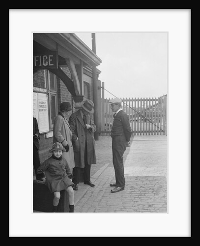 Group of people outside a Metropolitan Line railway station, London, 1930s. by Bill Brunell