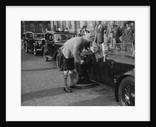 Kitty Brunell in her Aston Martin, chatting to a man in Highland dress, RSAC Scottish Rally, 1933 by Bill Brunell
