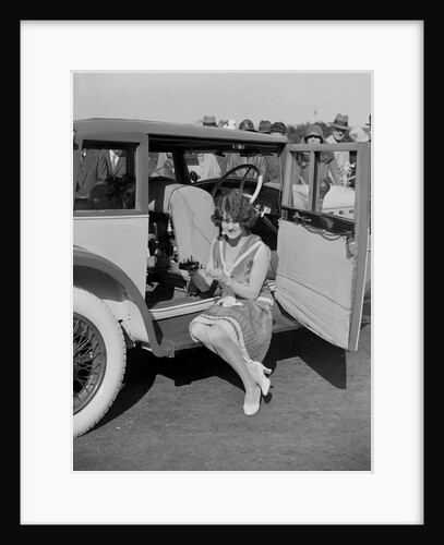 Paddy Naismith pouring a drink from the cocktail bar in her Ballot at the Southport Rally, 1928 by Bill Brunell
