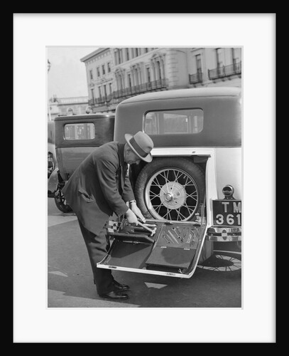 A driver opening the fitted toolkit of his Ford Model A at the Southport Rally, 1928 by Bill Brunell