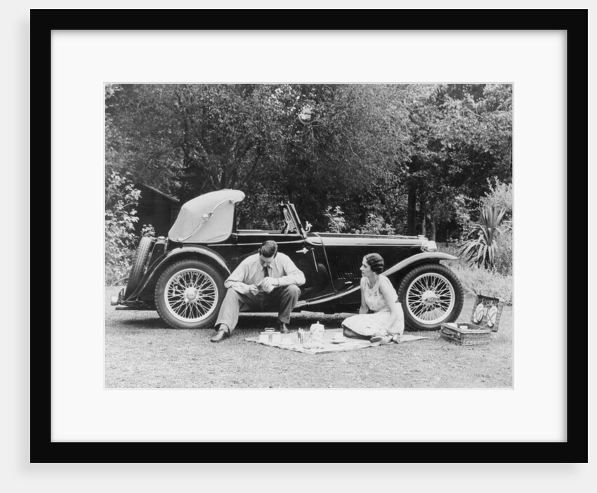 Couple having a picnic by an MG TA Midget, late 1930s by Unknown