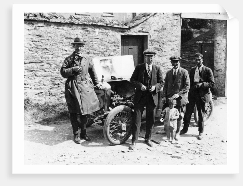 Bedford standing at the front of a car, with onlookers by Unknown