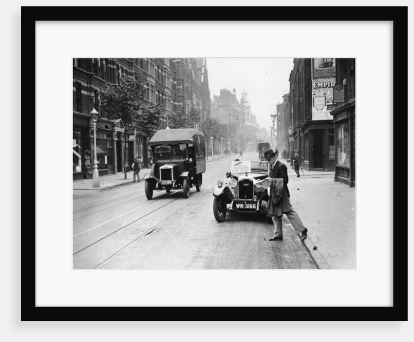 A Rover 1928 10/25 HP sports car parked in a London street, 1931 by Unknown