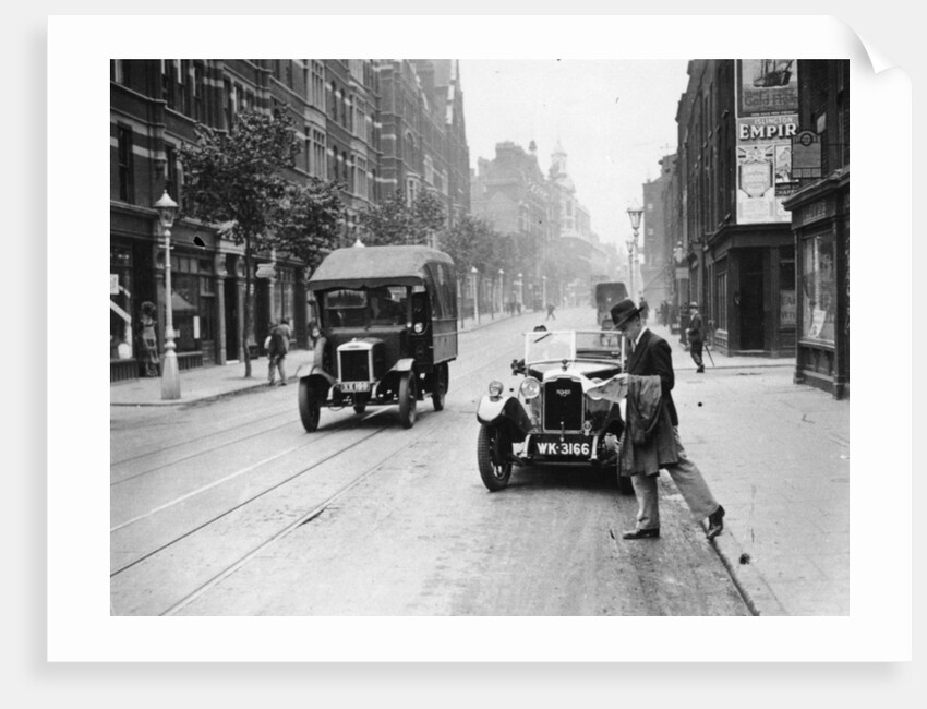 A Rover 1928 10/25 HP sports car parked in a London street, 1931 by Unknown