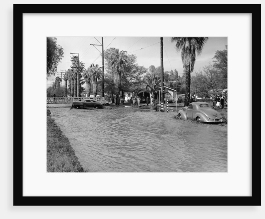 A Pontiac and a Willy's in a flood, USA, c1941 by Unknown