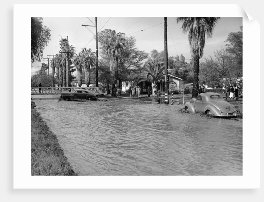 A Pontiac and a Willy's in a flood, USA, c1941 by Unknown