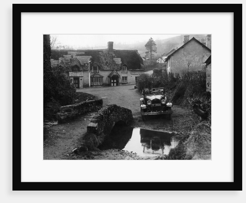 Kitty Brunell at the wheel of a Ford Model A by Anonymous