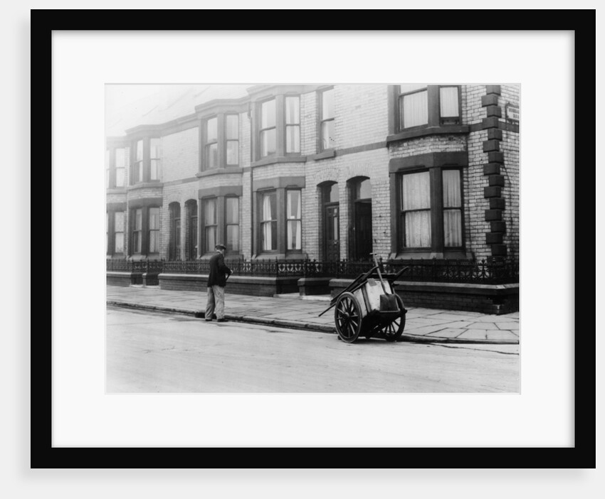 An 'Orderly Boy' and his cart sweeping a street, Liverpool, 1935 by Unknown
