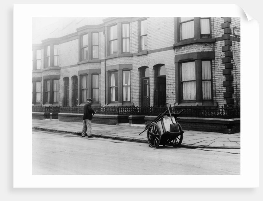 An 'Orderly Boy' and his cart sweeping a street, Liverpool, 1935 by Unknown