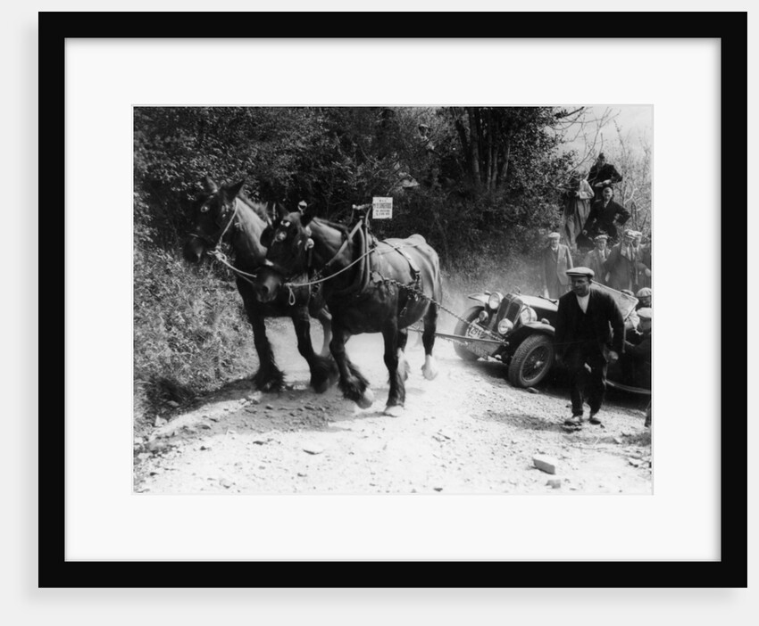 Horses pulling an MG up a hill by Anonymous