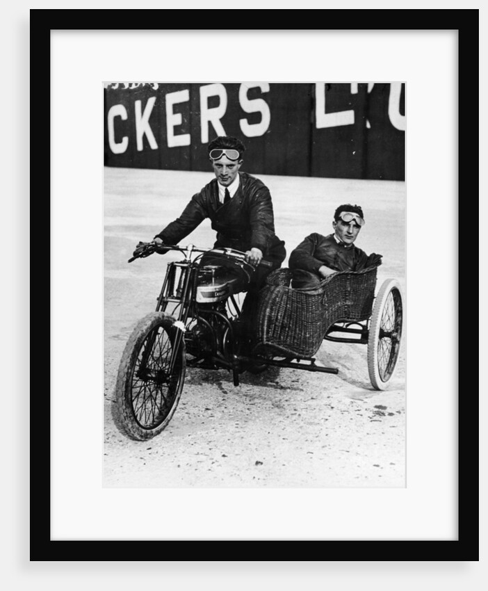 Tudor and Thompson riding a motorcycle and sidecar by Unknown