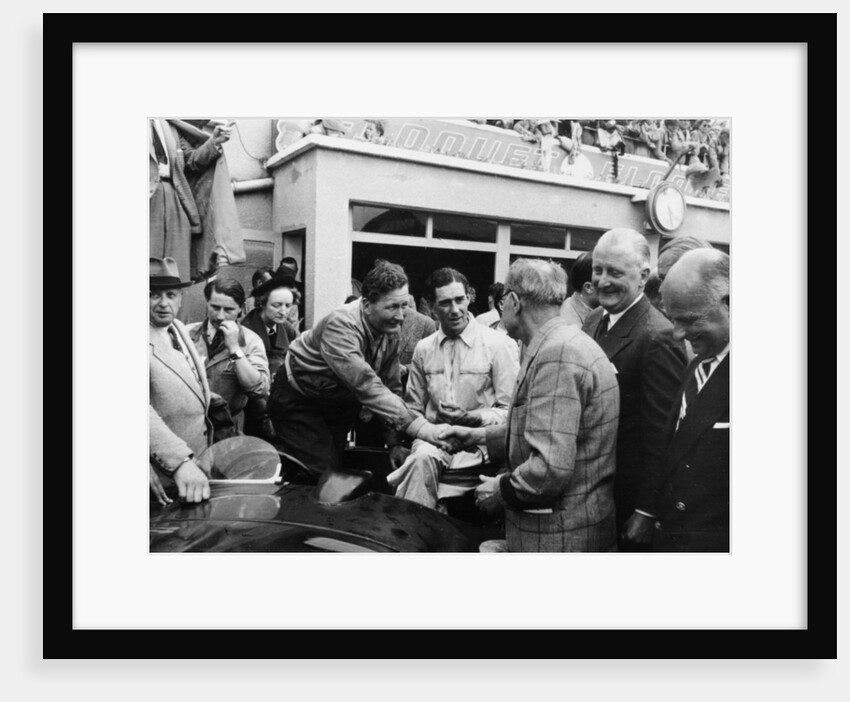 Peter Whitehead being congratulated on his victory with Peter Walker of the Le Mans 24 hours, 1951 by Unknown