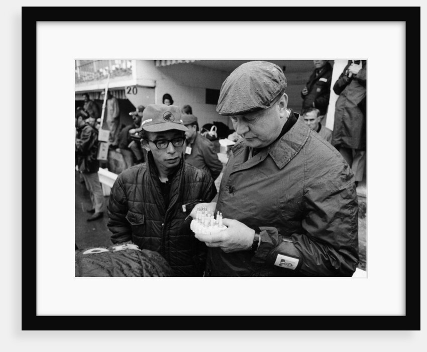 Honda technicians selecting the appropriate plugs by Unknown