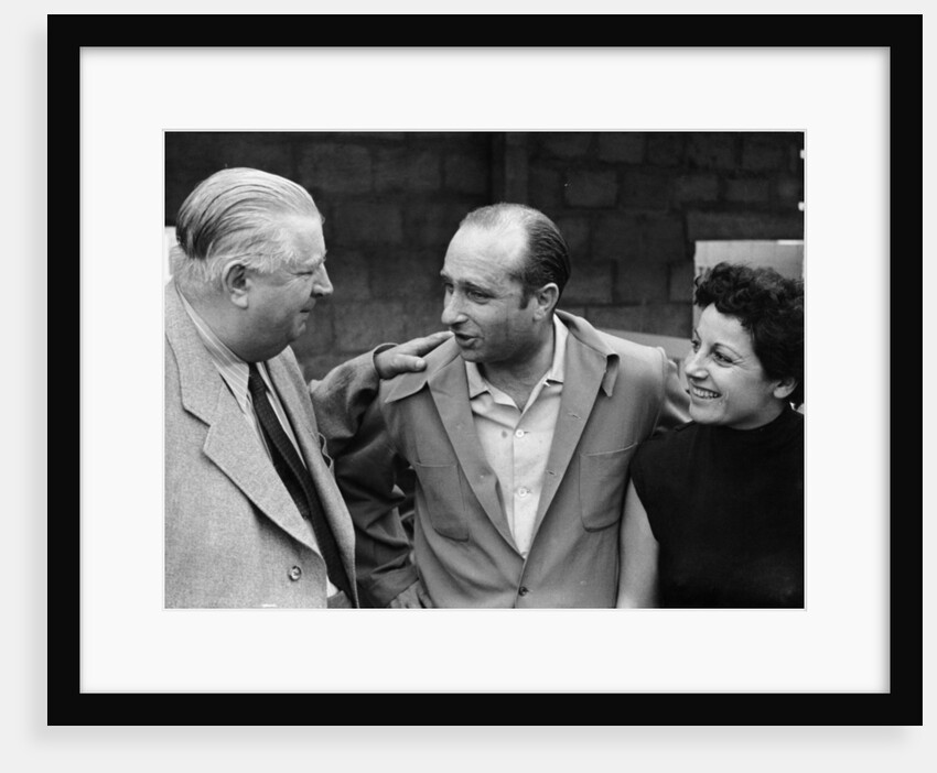Alfred Neubauer with Juan Manuel Fangio and his wife by Anonymous