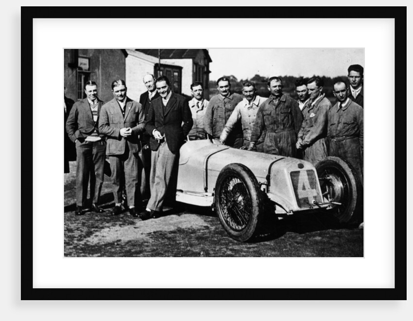 Robert Benoist with a cigarette, leaning against a Delage 15-S8, 1927 by Unknown