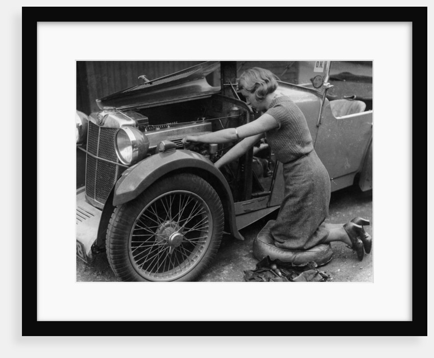 Kitty Brunell working on her MG F Magna by Unknown