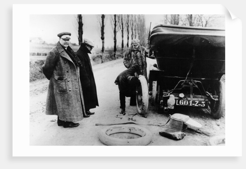 Lord Northcliffe's chauffeur changing a tyre, (c1908?) by Unknown