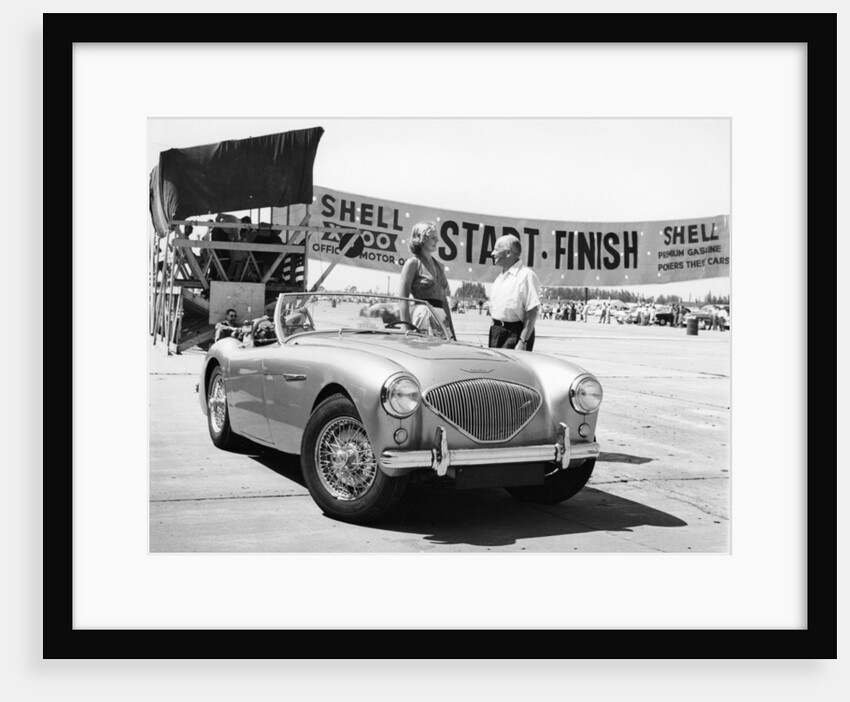 Donald Healey with an Austin Healey at a motor race by Unknown