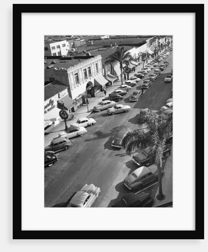 Street scene with cars parked, USA, c1952 by Unknown