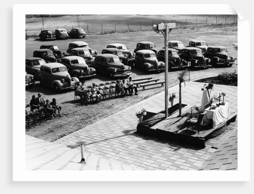 Outdoor church service with cars parked behind, USA, (1950s?) by Unknown
