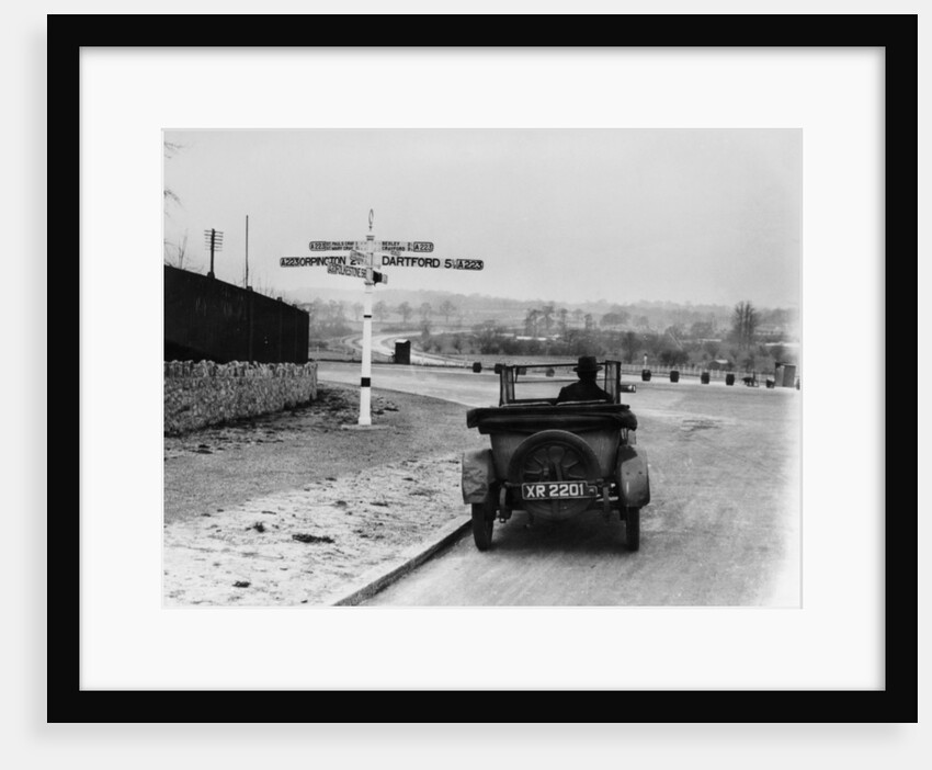 Car near a road sign, Bromley, Kent, 1920s by Unknown