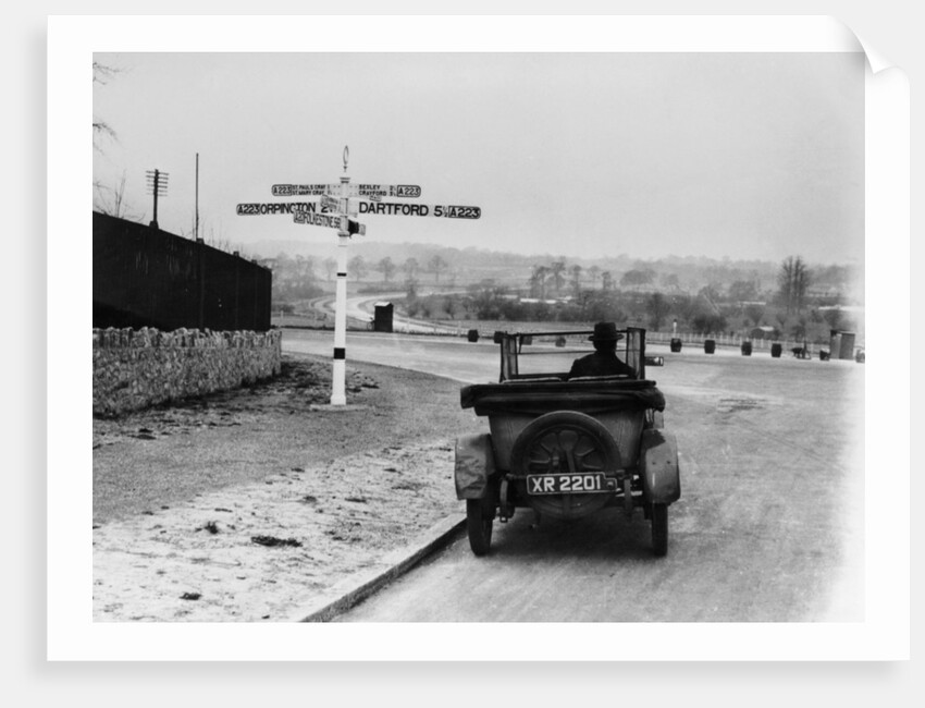 Car near a road sign, Bromley, Kent, 1920s by Unknown