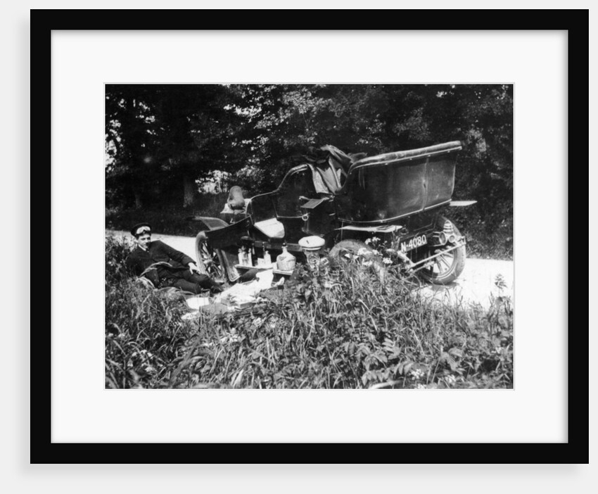 Two men picnicking beside a Vauxhall car, c1906 by Unknown