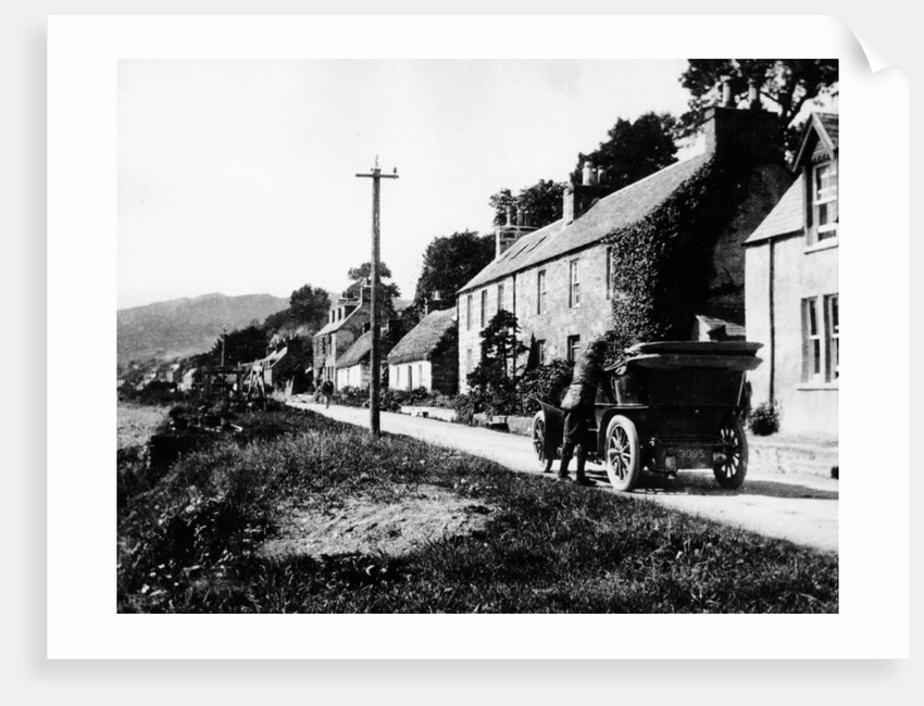 A man by his car in a village lane, 1900 by Unknown